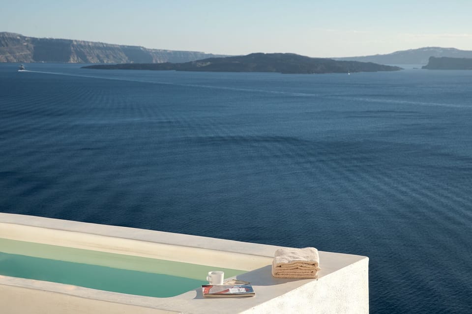 Hot tub with an amazing view to the famous Volcano of Santorini and the sea