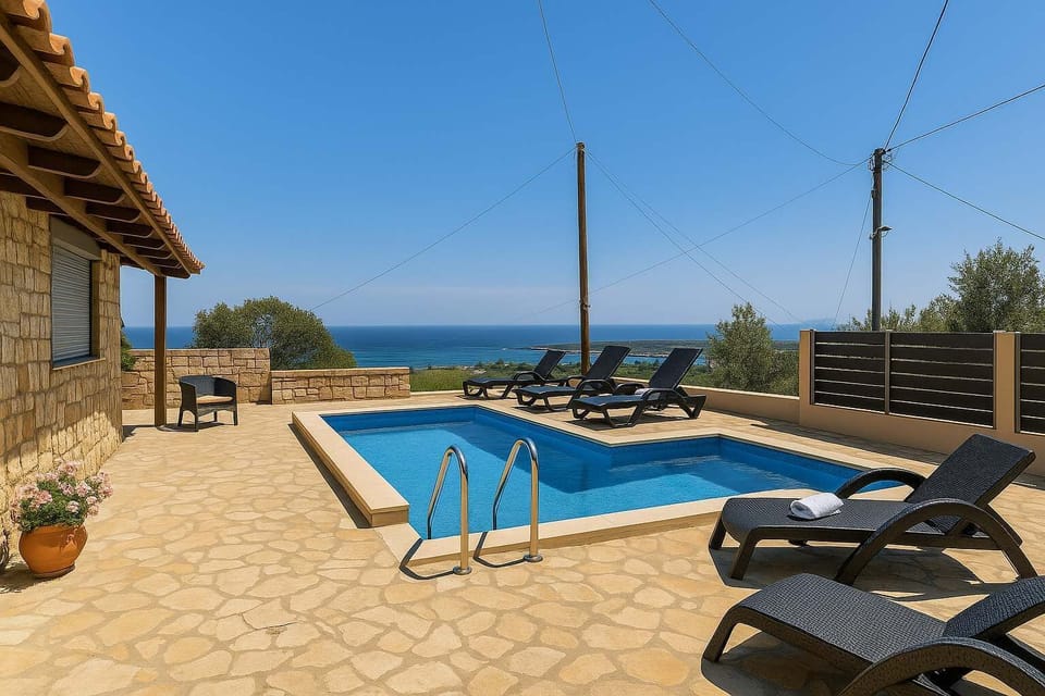 Shared Pool Area with Panoramic Views – Expansive shared pool between two properties, offering open skies, sun loungers, and wide scenic vistas.