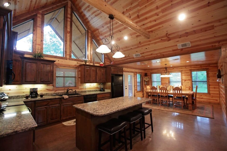 Cook, gather, and stay awhile in this warm wood-beam kitchen