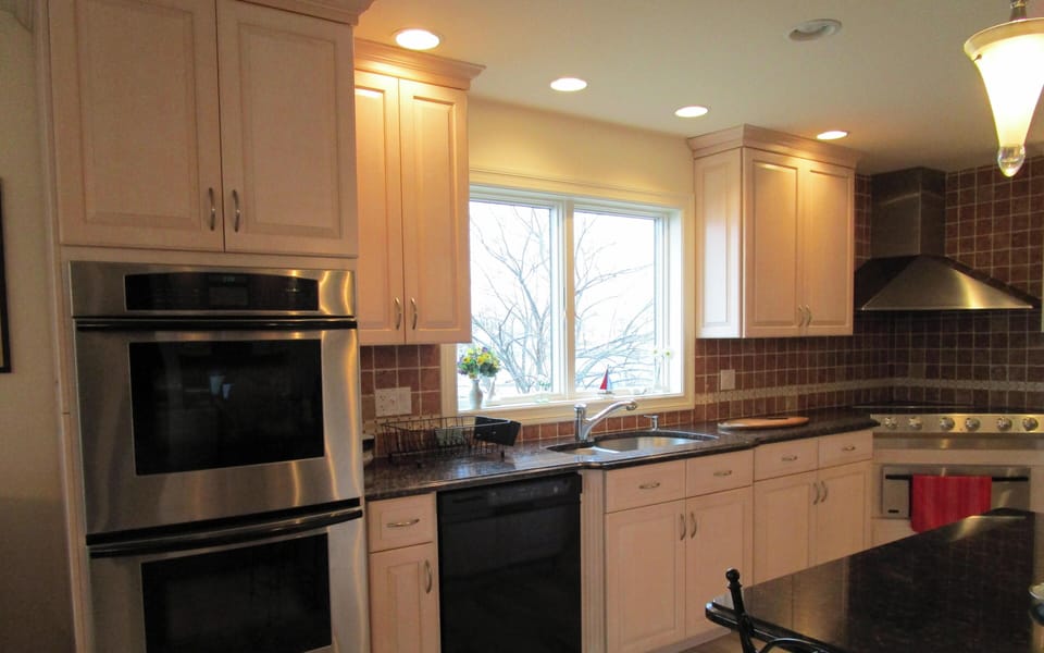 kitchen - Electrolux cooktop, Thermador double oven, Kitchenaid dishwasher, sink