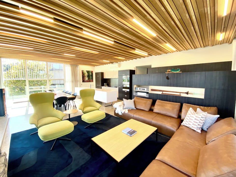 Seating for 10 in spacious living area, 58" smart TV and HiFi, NZ artwork