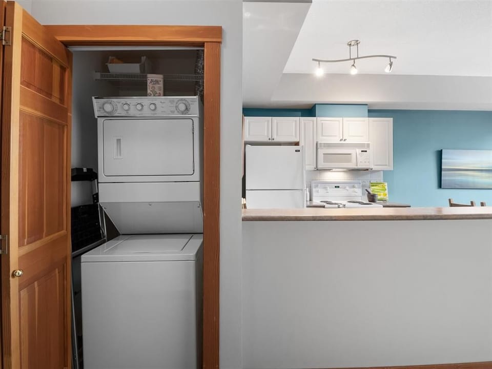 Washer and dryer with laundry detergent available to guests