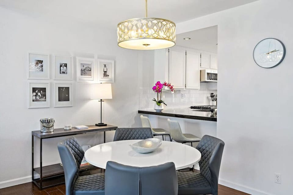 Gather around this stylish dining space with soft lighting and sleek design set the perfect scene for memorable meals and conversations.
