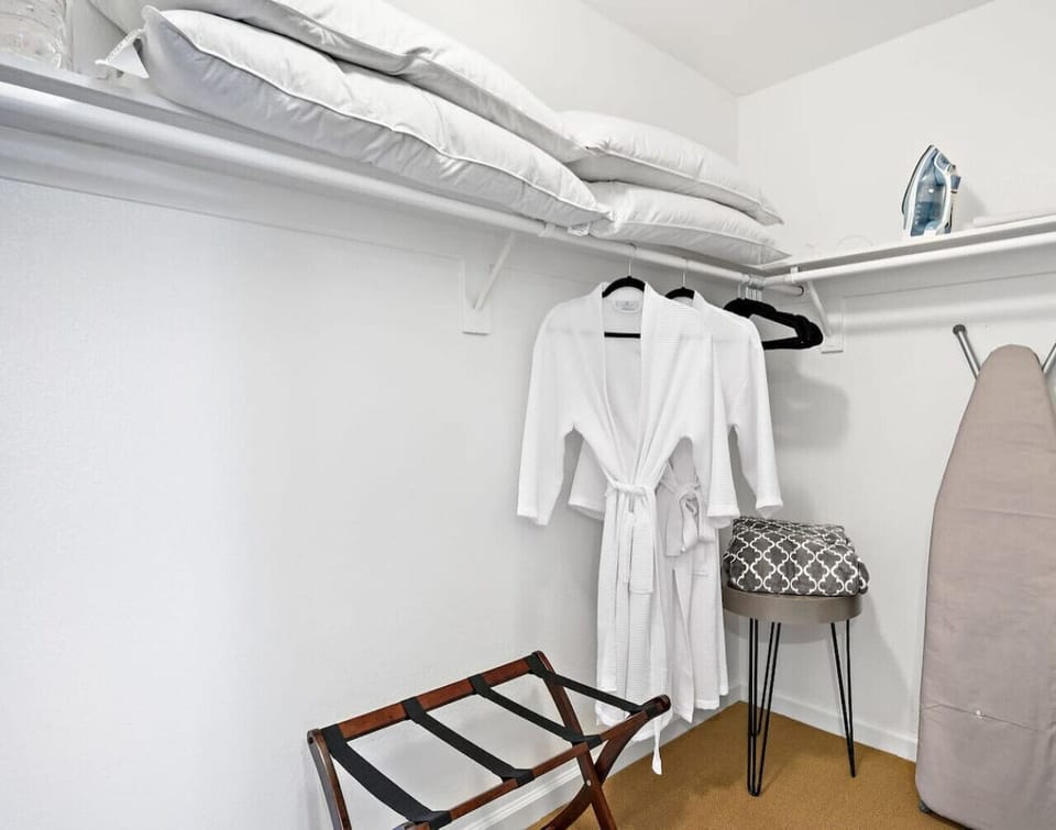 A spacious and organized walk-in closet designed for convenience. Unpack, settle in, and enjoy a clutter-free stay!