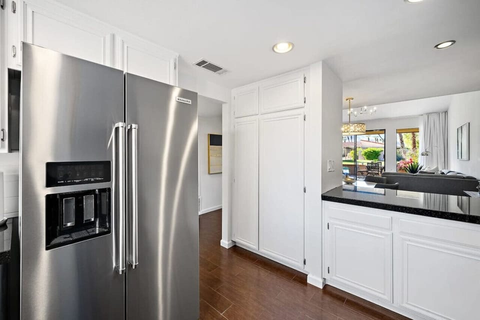 This sleek, open-concept kitchen blends style and function, perfect for effortless entertaining. Enjoy modern elegance with a view that steals the show!