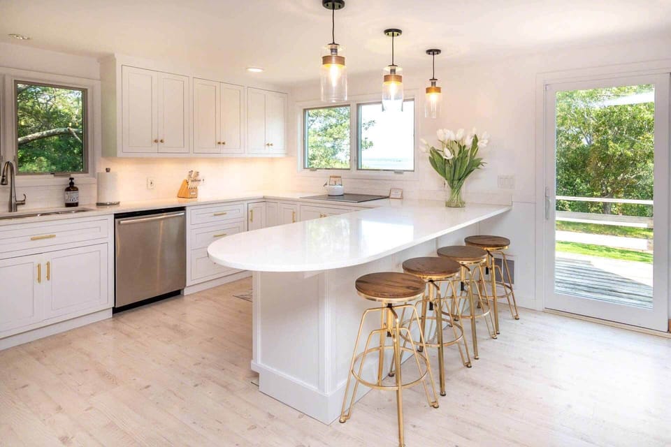 Kitchen Has Stainless Steel Appliances and a Breakfast Bar with Seating for 4 and Quartz Counters - 1st Floor