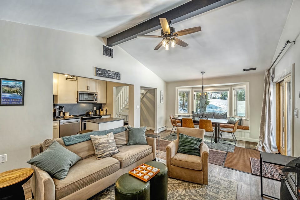 View of the kitchen, the dining table and living room