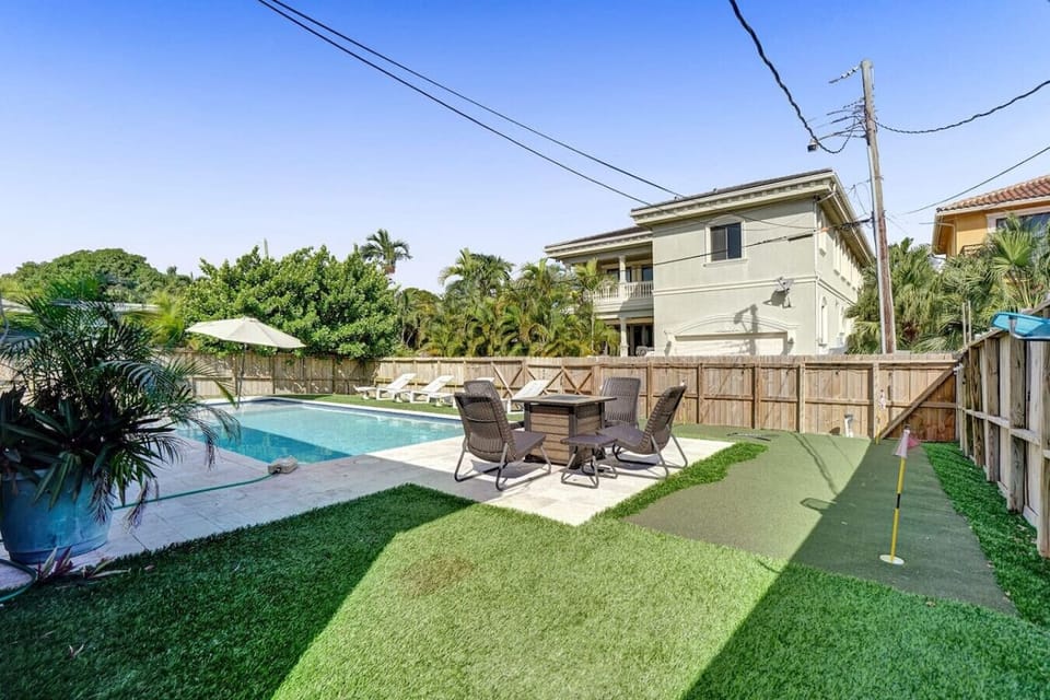 The umbrella by the pool is no longer here