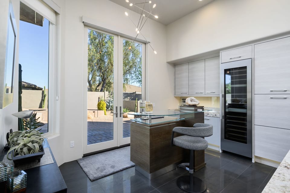 Bar nook area with additional plastic glasses for the pool & outdoor fireplace