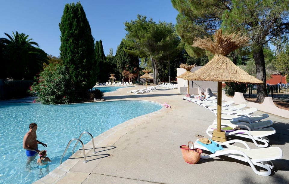 Lounge by the pool in the sunshine.