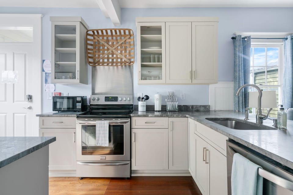 Modern, fully stocked kitchen with everything you need for a home-cooked meal.