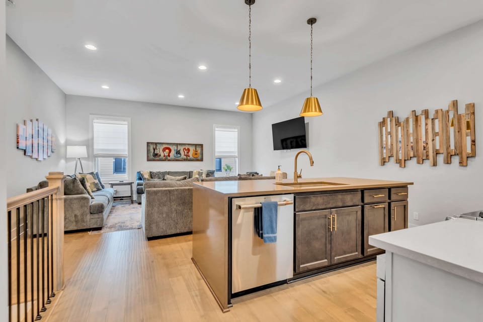 Well-equipped kitchen featuring a gas range stove and a convenient view looking toward the main entrance hall.