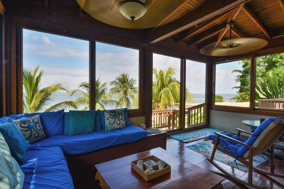 Sunroom overlooking the beach and pool.