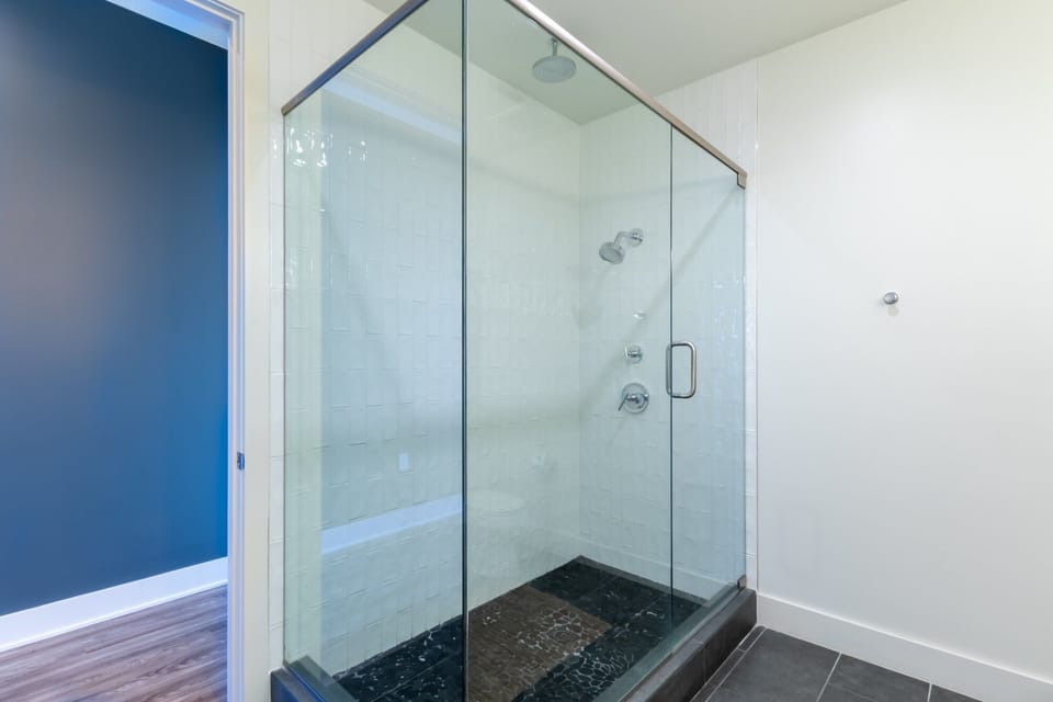 Master bathroom with double vanity & full glass shower