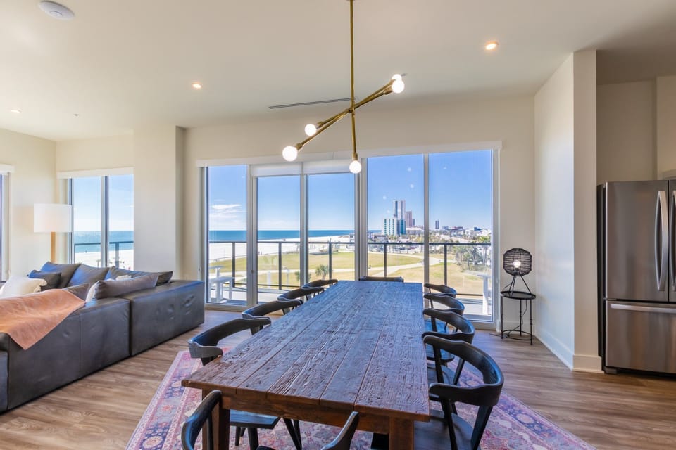 Open floor plan from the kitchen to the living room. Dining room table that seats 10. Floor to ceiling windows throughout the unit!