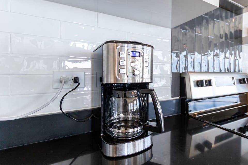 Coffee maker that has a cone filter.