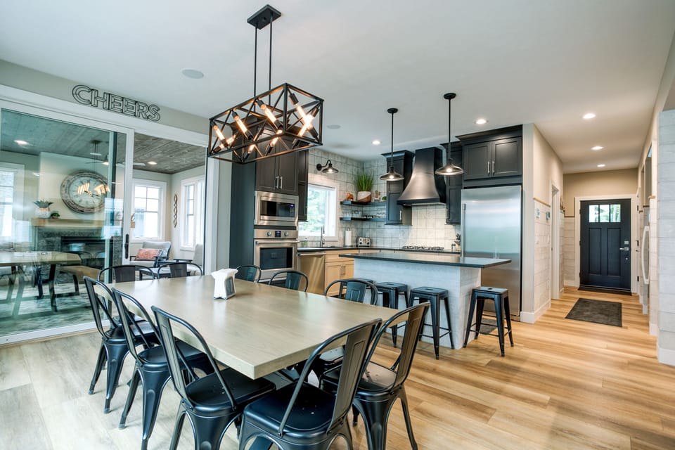 Black House: Kitchen,  4 Season Screened Porch. Dining Table with Seating for 10