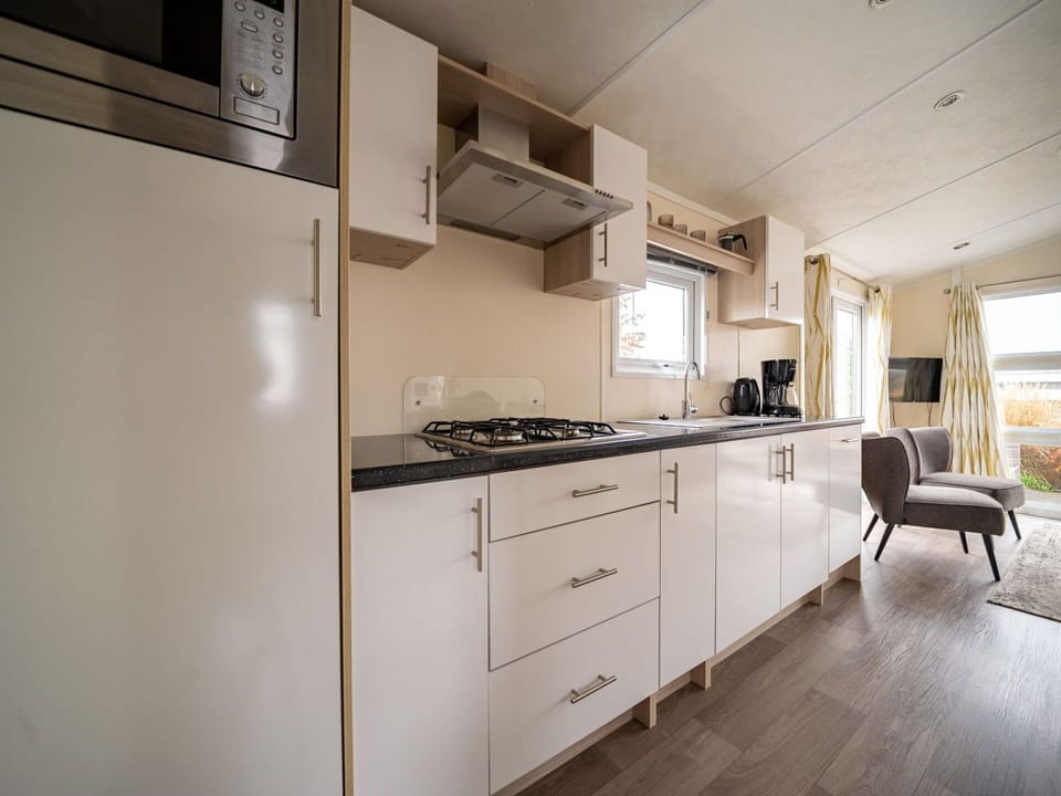 Cabinetry, Furniture, Building, Countertop, Kitchen Stove, Kitchen Appliance, Chair, Drawer, Kitchen, Wood
