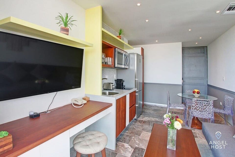 There’s even a little desk area under the TV if you must work (we hope not!)