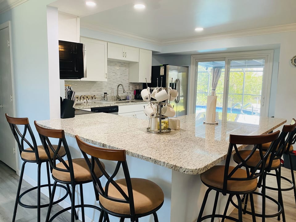Kitchen area with full view of pool.