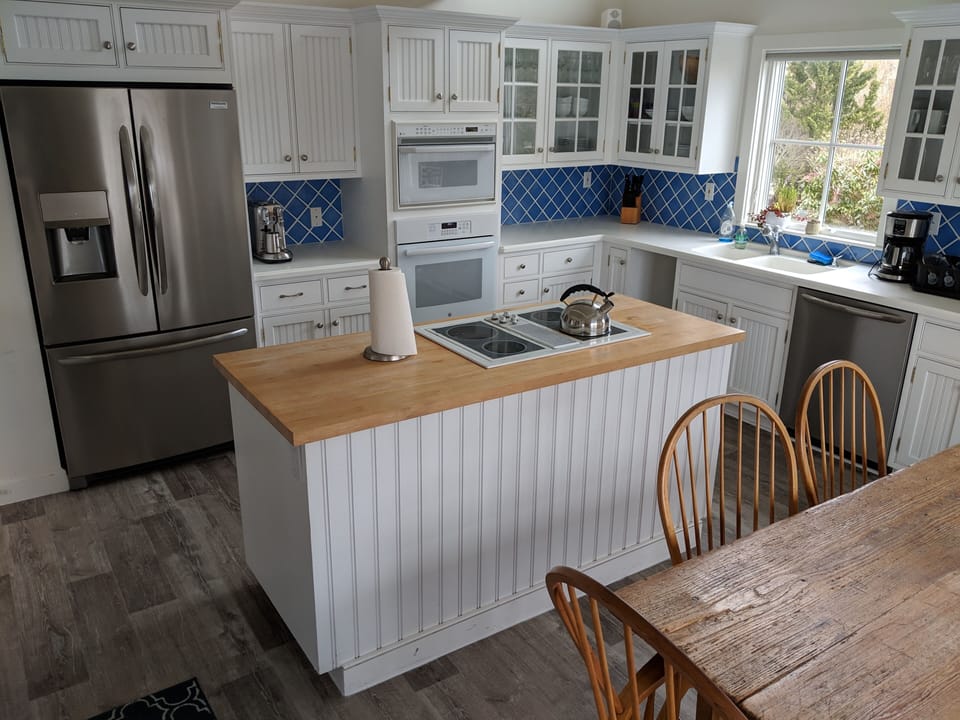 Kitchen (door to side deck and grill on other side of table)