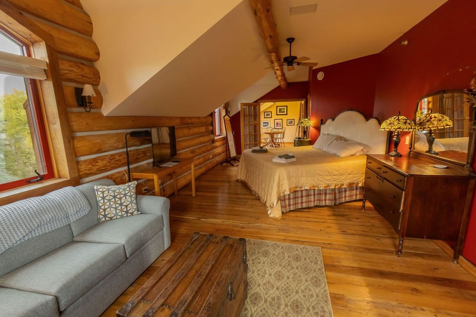 The spacious Evergreen Suite with private dining nook (upper level; king plus queen sofa bed)