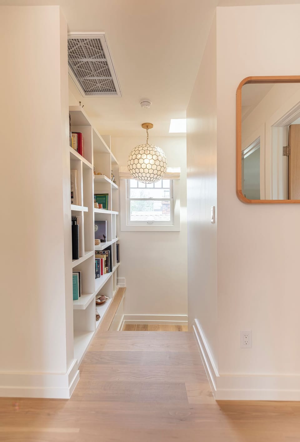 Primary bedroom and guest bedrooms to the right.