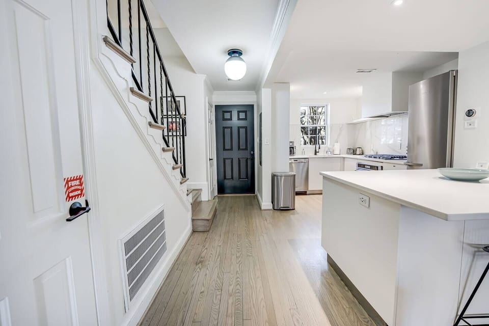Front Entrance: Half Bath, Open Concept Kitchen & Island.