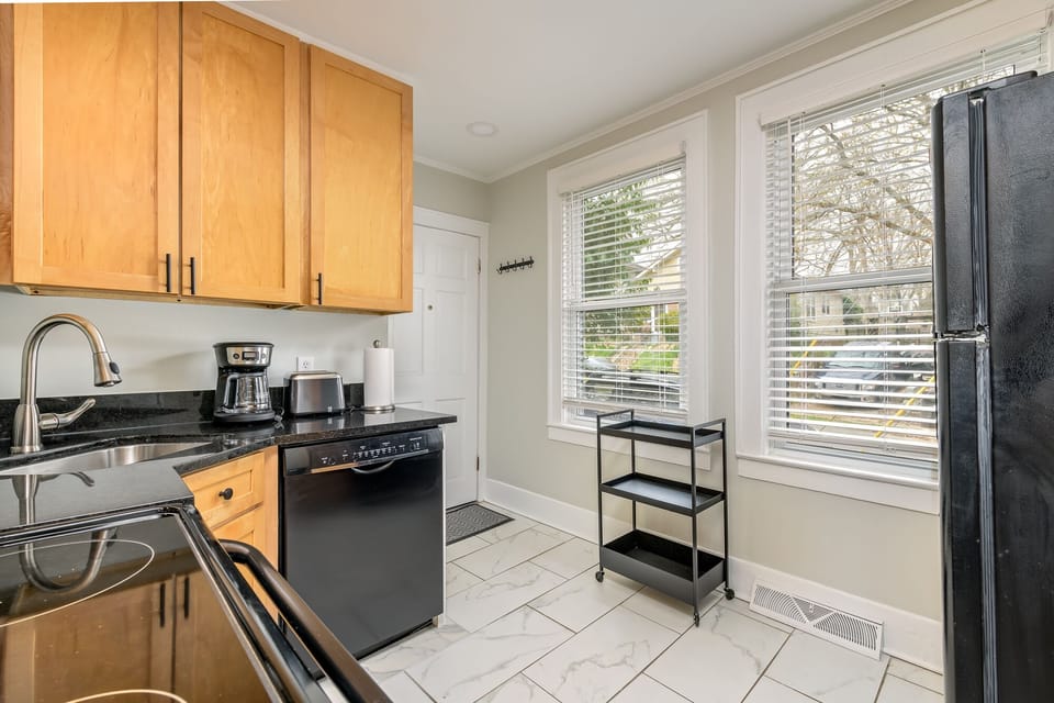 Whisper quiet Bosch dishwasher, and black granite countertops.