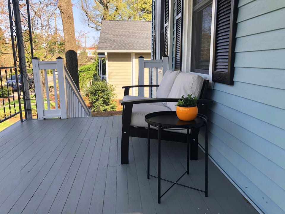Spacious front porch overlooking pretty trees
