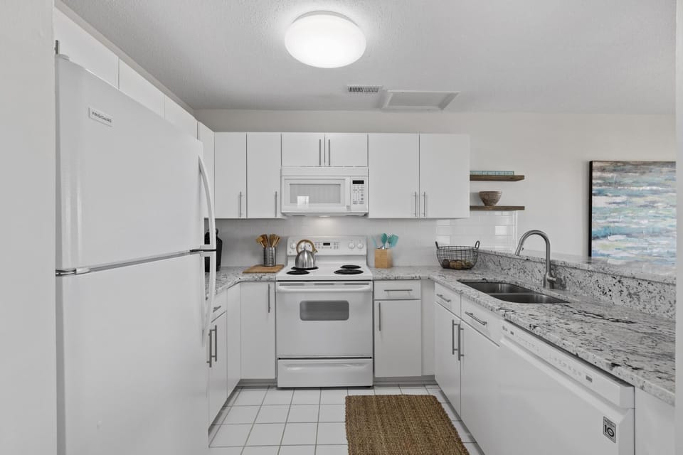Fully stocked kitchen with granite counter tops and everything you need