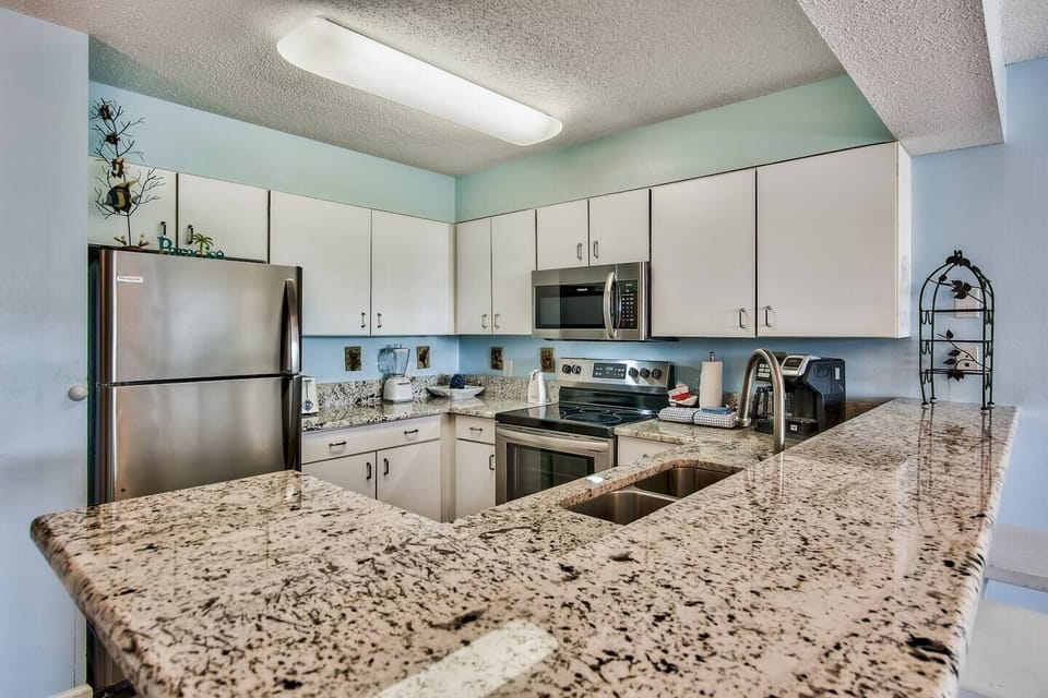 Spacious kitchen with beautiful granite counter top