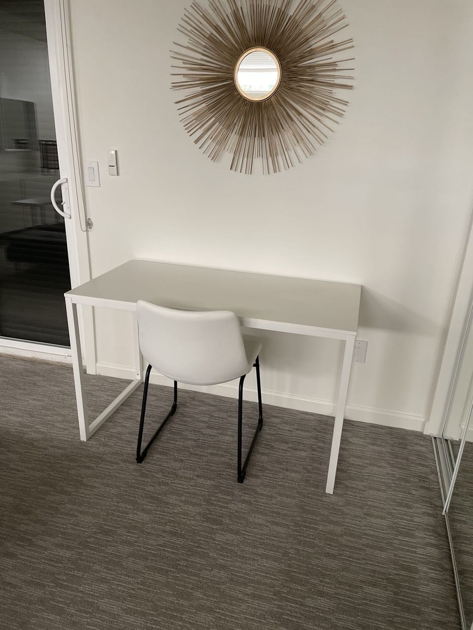 This desk is in the primary bedroom. A separate monitor is available.