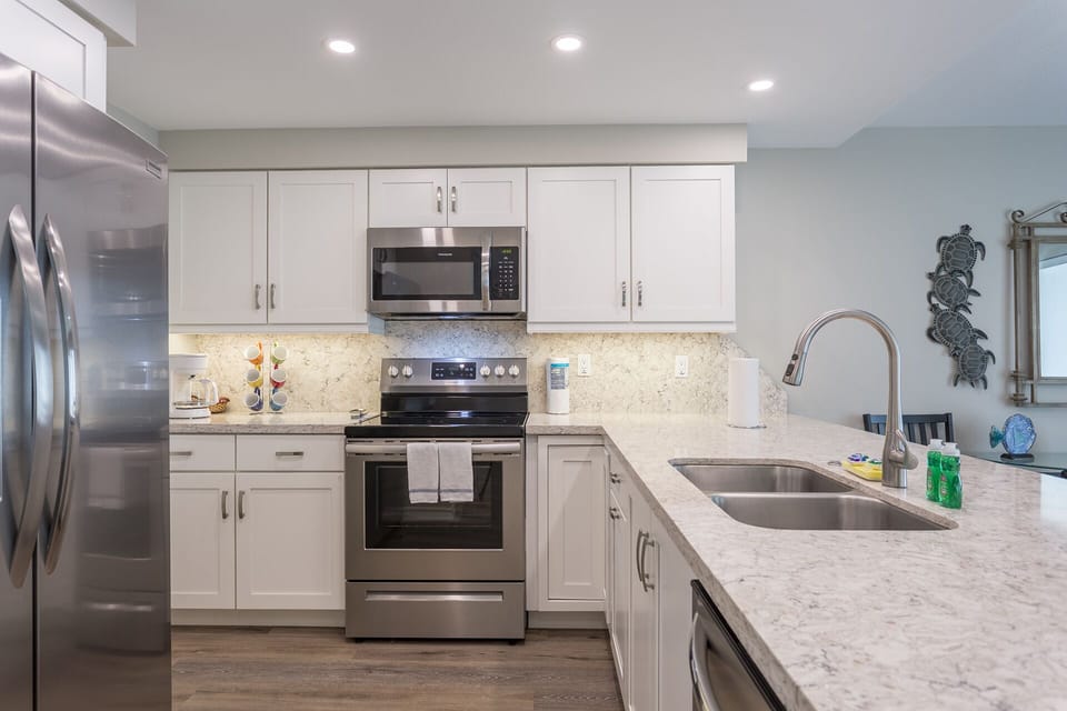 Kitchen has stainless steel appliances, including a dishwasher!