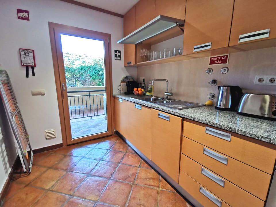 Kitchen opens onto a small front patio