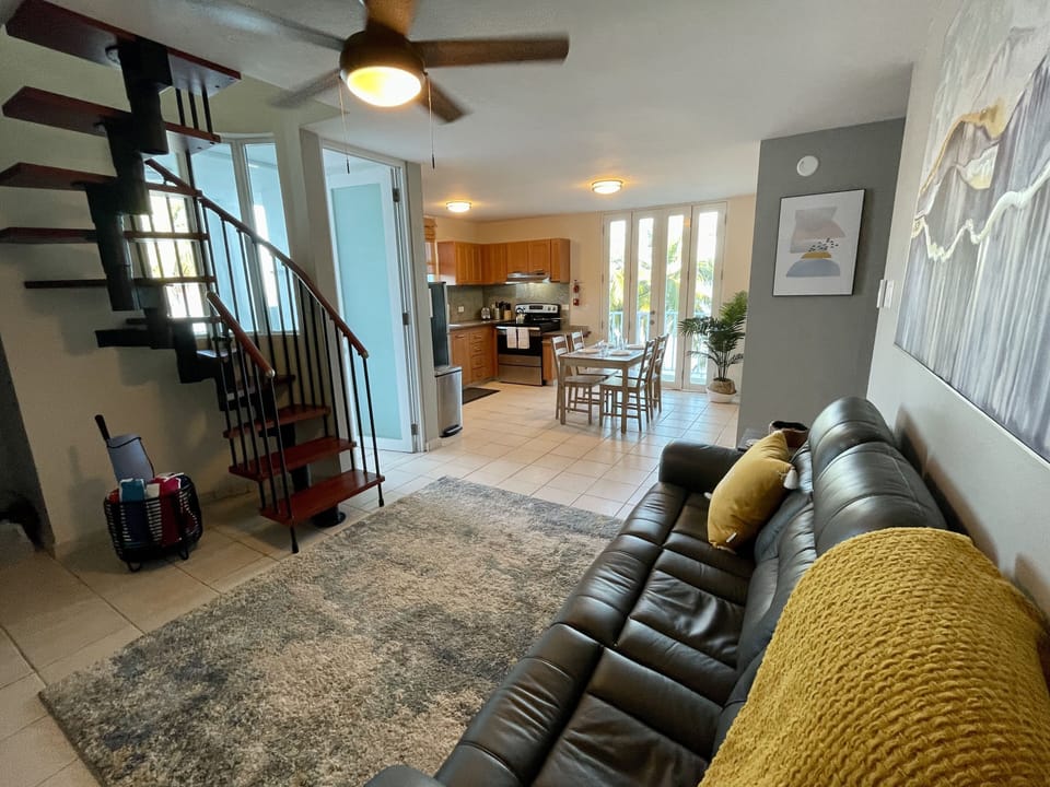 Relax on the main level living room with cold A/C. 