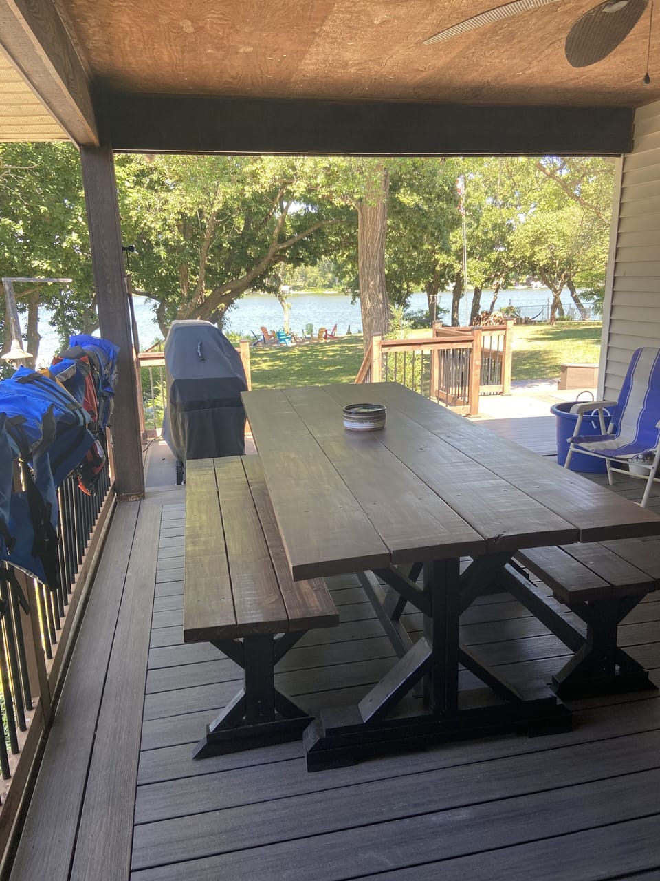 covered deck with seating and gas grill 