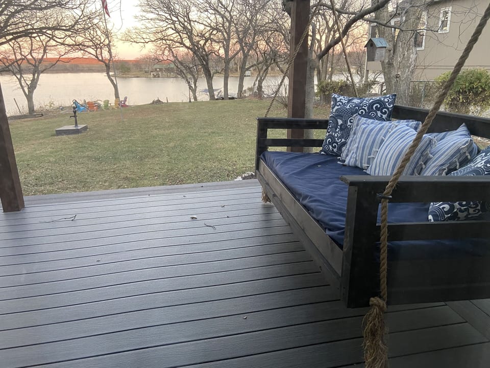 Large bed swing under the pergola on the large deck.