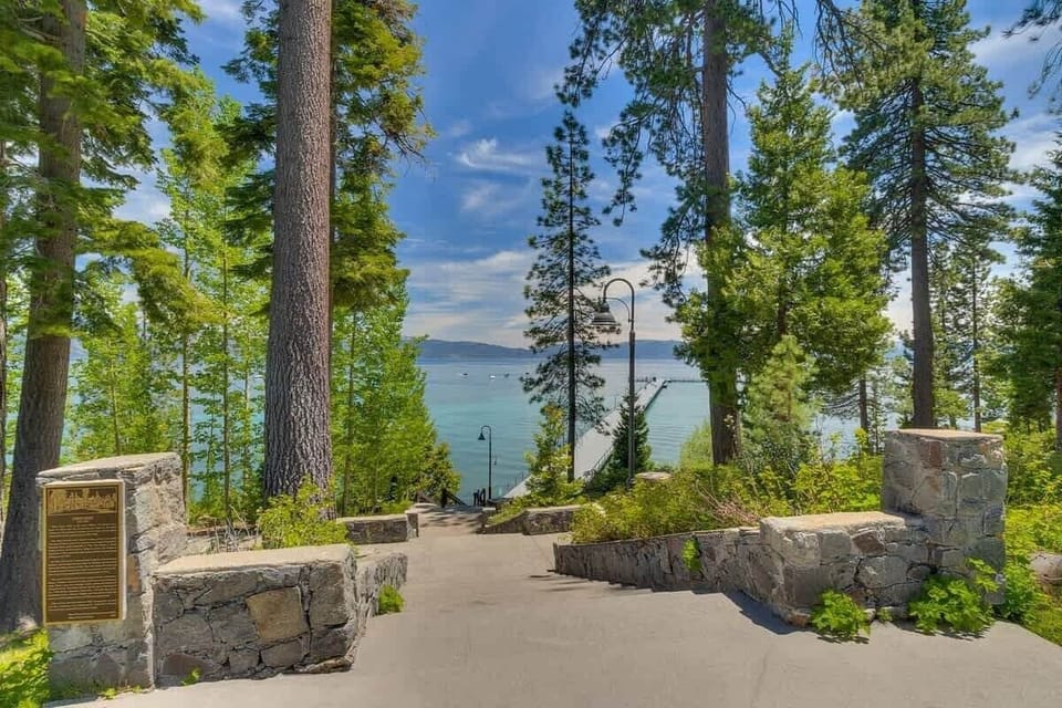 Main Meadow with staircase to lakefront pool, beach and pier