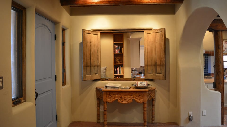 Front entry foyer showing peak-a-boo glimpse into alcove getaway with computer desk