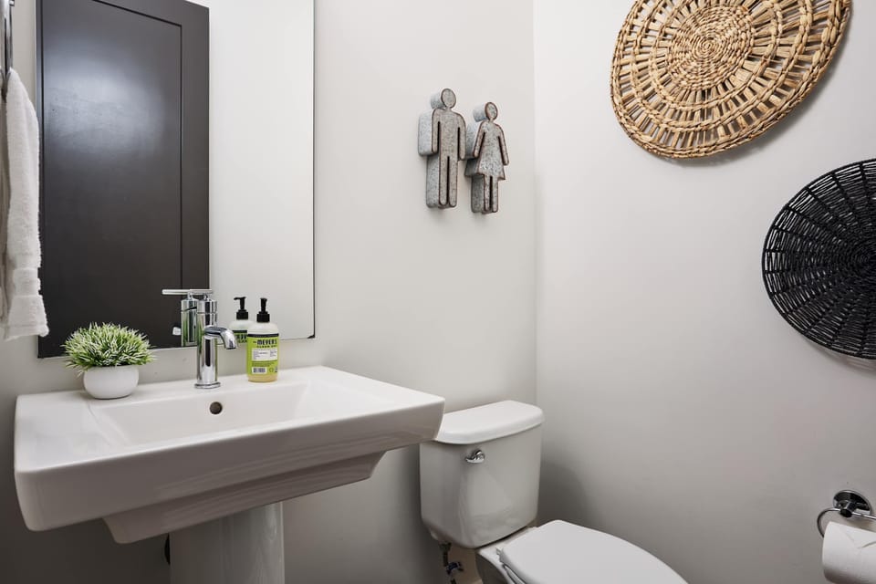 Thoughtfully placed and beautifully designed, this half bath adds comfort and ease to your visit.

