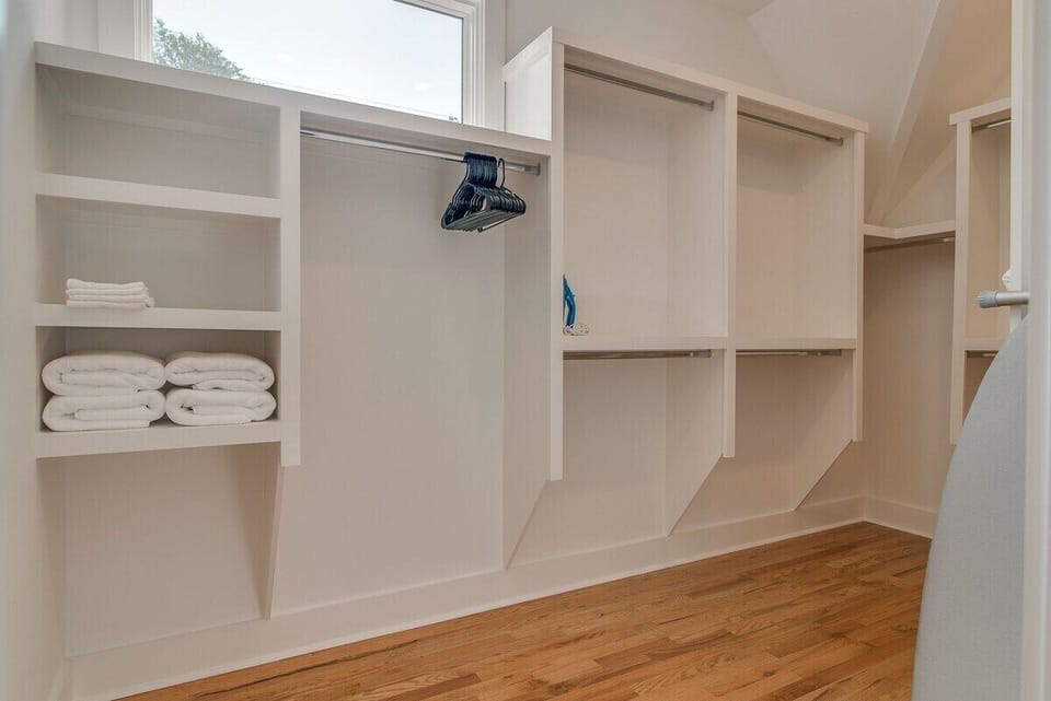 Pack in all your clothes and accessories with ease in this spacious walk-in closet in the primary bedroom.