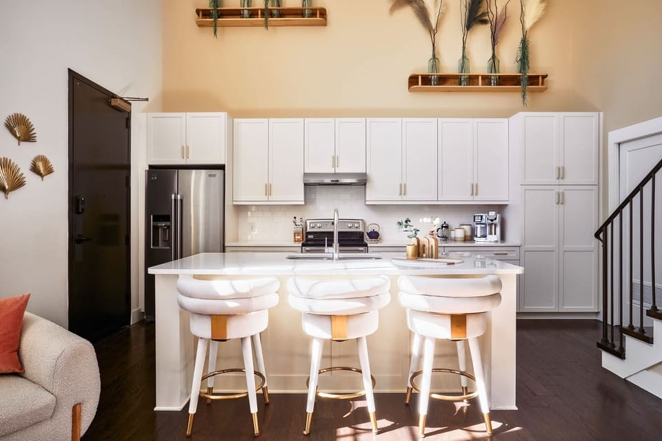 Bar stools add the perfect perch for easy dining, conversation, or a cozy start to the day.