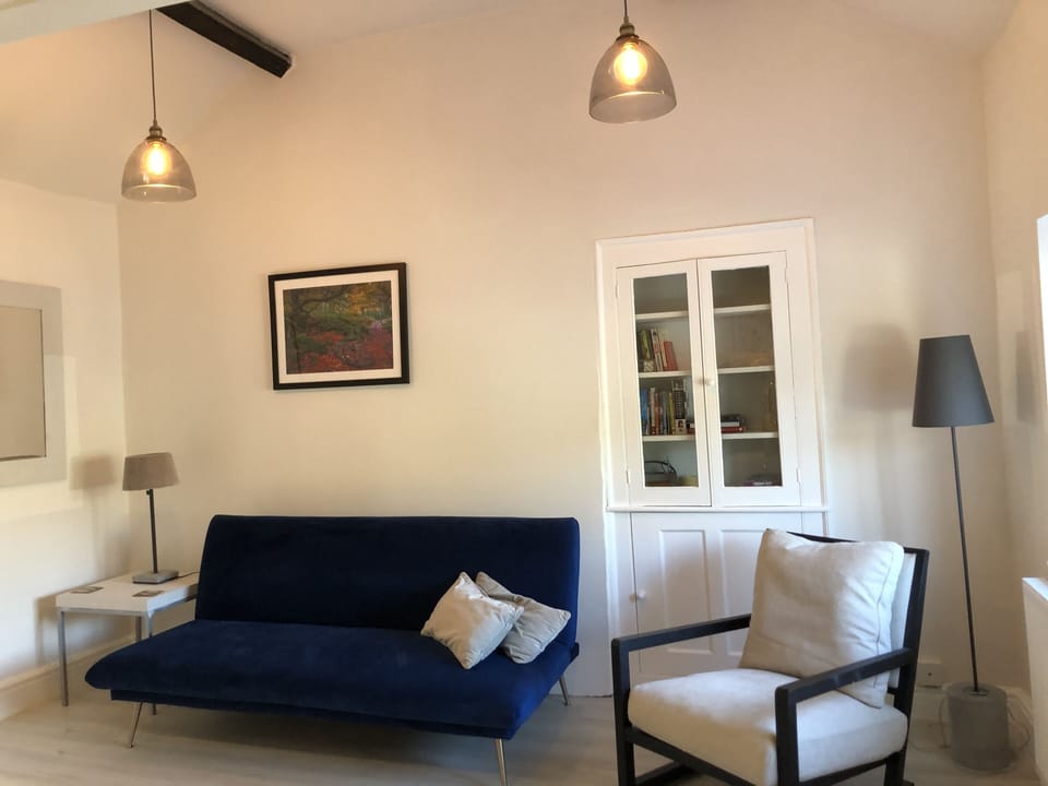Sitting room with vaulted beamed ceiling and views of the surrounding peaks. 