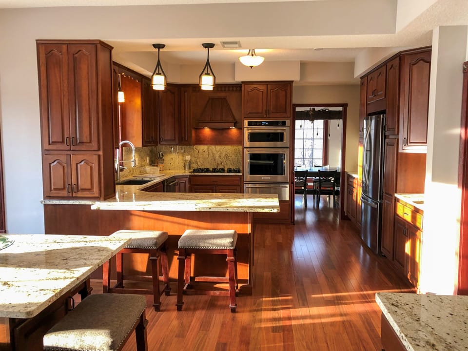 Newly remodeled with cherry cabinets and floors. Seating for 8 at granite island