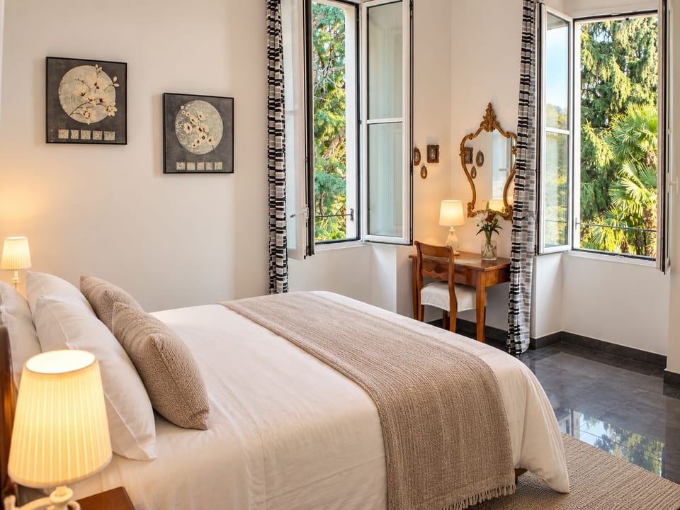 Palazzina GiardinoLago: Bianco by Lago Reisen Apartment in Domaso