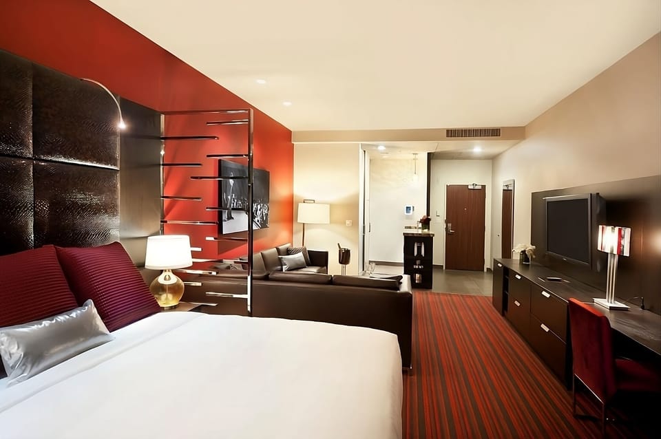 Settle in with a restful bed, desk, and big-screen TV.
