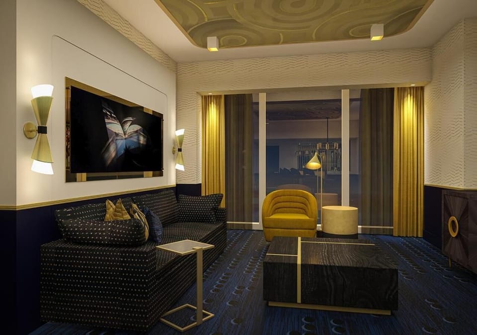 Unwind on plush seating beneath warm, ambient designer lighting.
