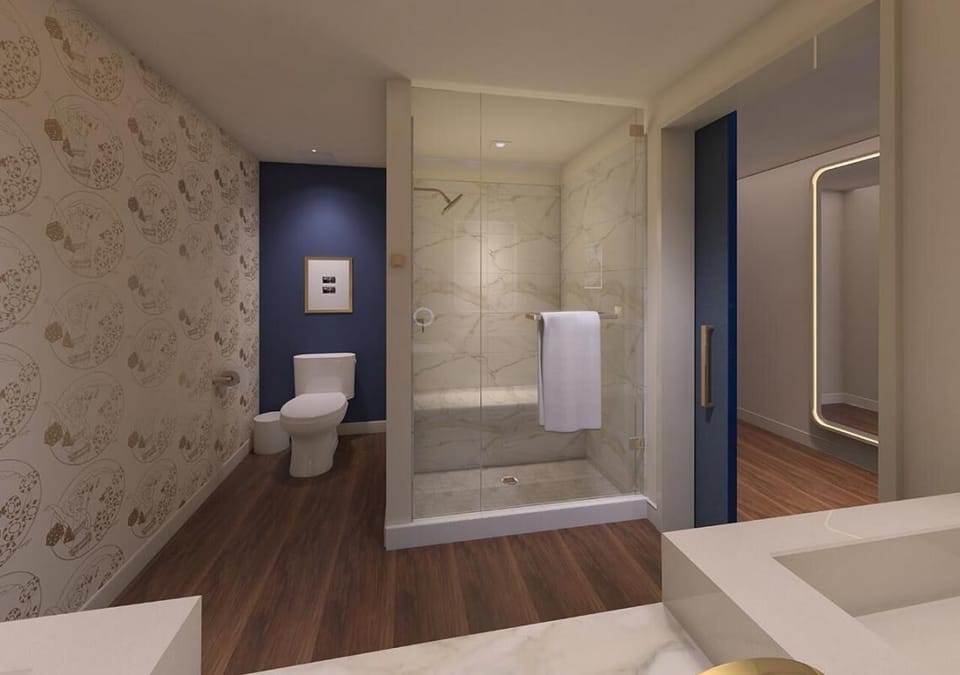 Refresh effortlessly in a sleek glass shower with spa-like calm.