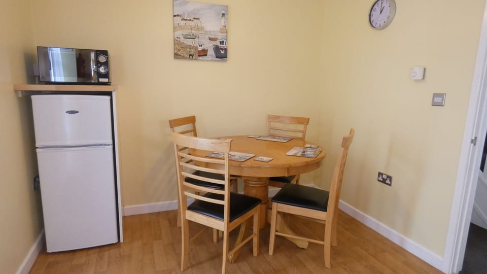 The kitchen also has a dining area, fridge/freezer and microwave.